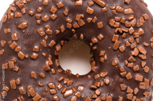 Chocolate donut on a white background close-up.