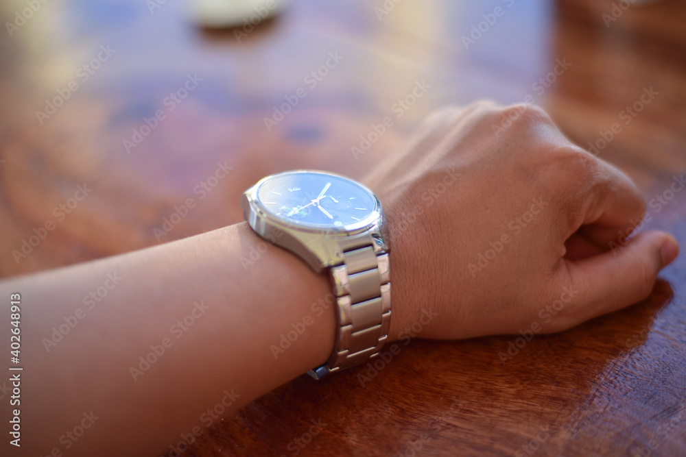 Fototapeta premium Businessman looking at his watch.
