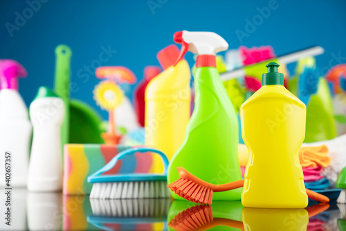 House and office cleaning theme. Colorful cleaning kit on blue background. 