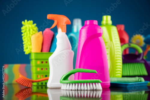 House and office cleaning theme. Colorful cleaning kit on blue background. 