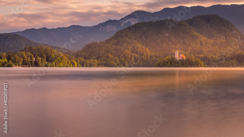 Panoramic evening view of Pilgrimage Church of the Assumption of Maria. Fantastic summer scene of Bled lake, Julian Alps, Slovenia, Europe. Traveling concept background.