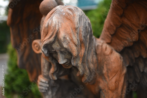 old sculpture of a fallen angel