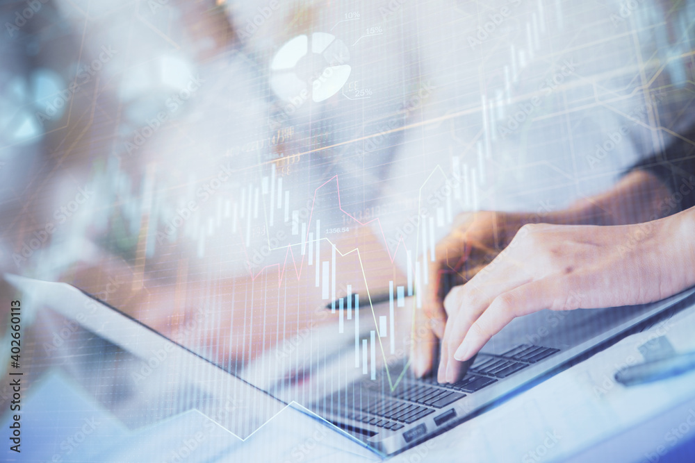 Double exposure of woman hands typing on computer and forex chart hologram drawing. Stock market invest concept. Double exposure of woman hands typing on computer and forex chart hologram drawing. Stock market invest concept.