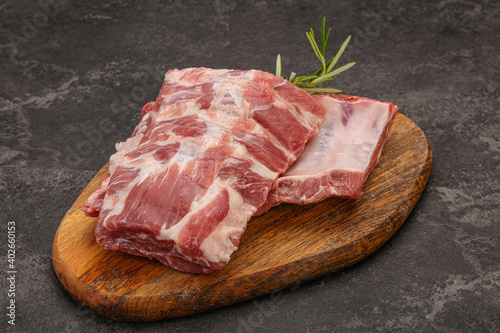 Raw pork ribs served rosemary
