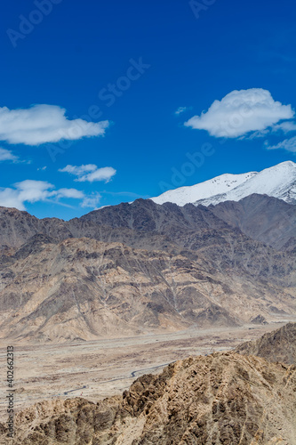 Beautiful landscape of Himalayas barren mountains with white snow  and blue sky   in Ladakh  Kashmir  view from Thiksey Monastery or Thiksey Gompa.
