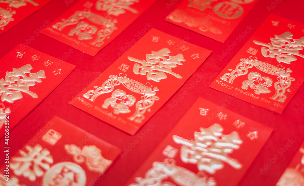 Chinese wedding gift red packets neatly arranged on red background Chinese wedding gift red packets neatly arranged on red background