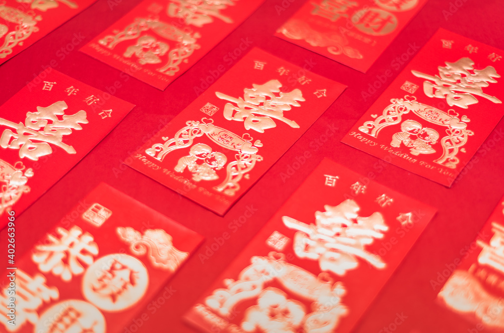 Chinese wedding gift red packets neatly arranged on red background Chinese wedding gift red packets neatly arranged on red background