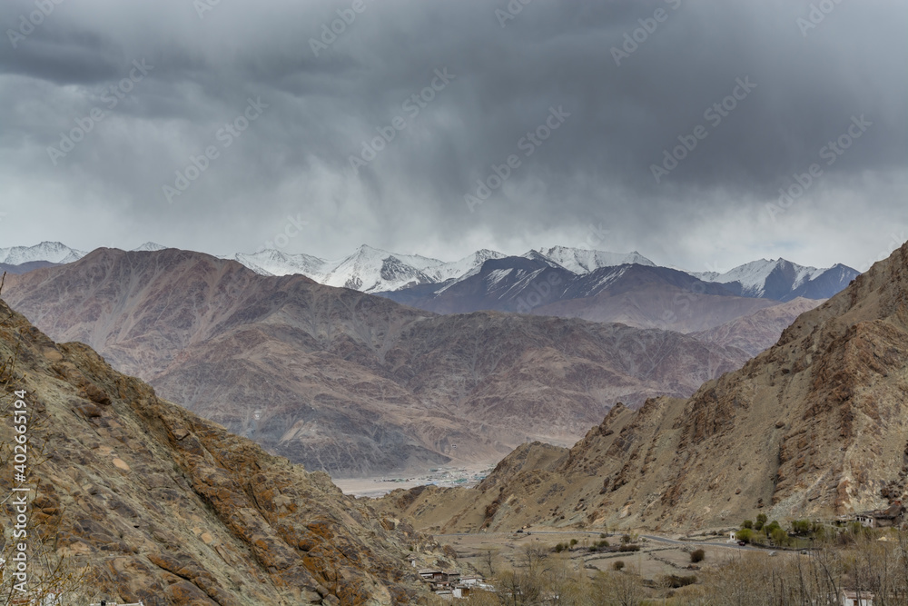 Himalayas mountain covered with snow, and background of cloudy sky, view from the Hemis monastery, near the Leh city, Ladakh, Jammu and Kashmir