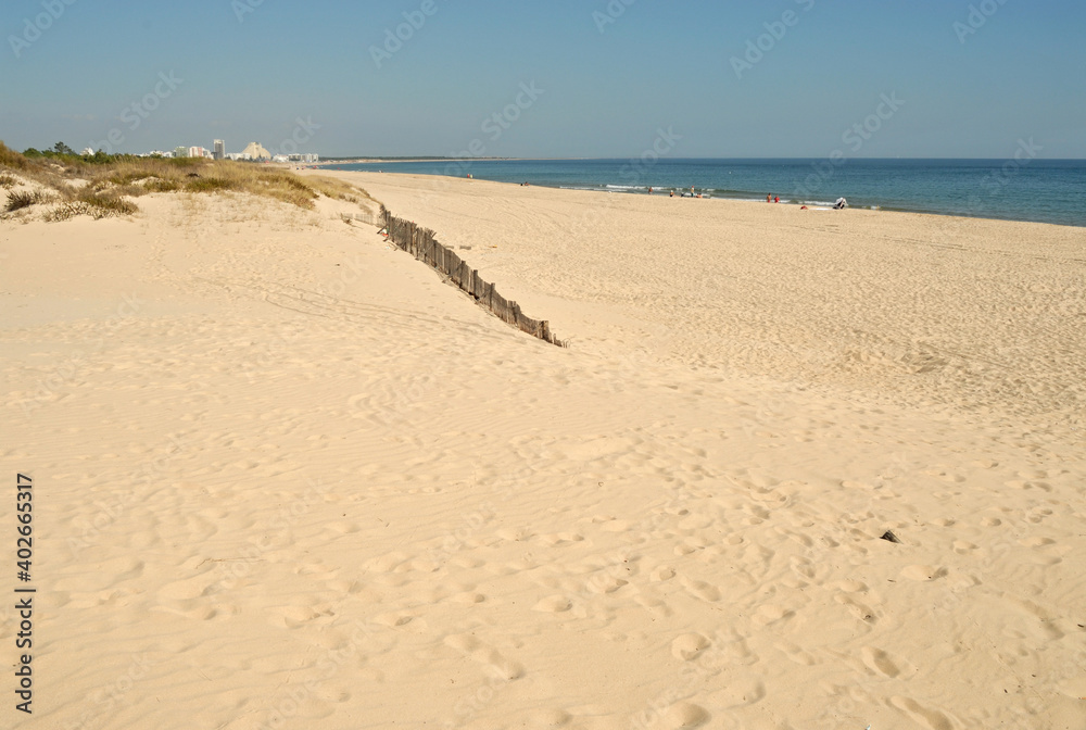 Sandy beach on the Farol Island near Faro, Algarve - Portugal 