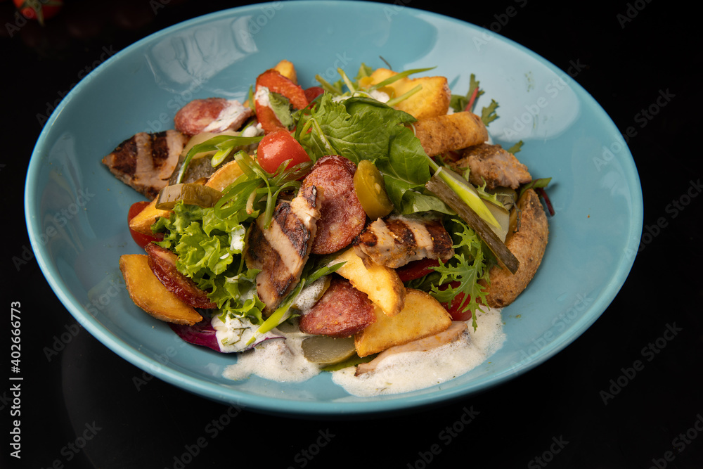 delisious fresh made salad on black background delisious fresh made salad on black background