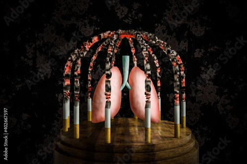 Photos Cigarettes lit in a cage shape hold a prisoner lung on wood round table with a crunched wall background