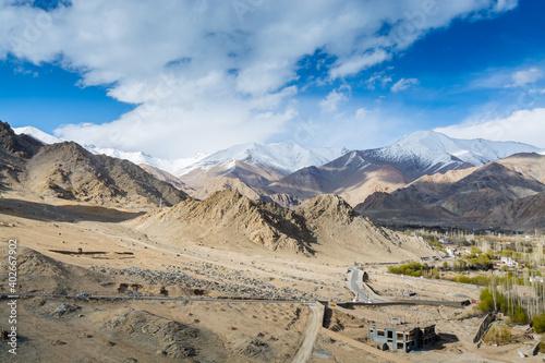 Aerial view of Leh Ladahk City of Kashmir with background of Himalaya mountain against blue sky, view from the Shanti Stupa