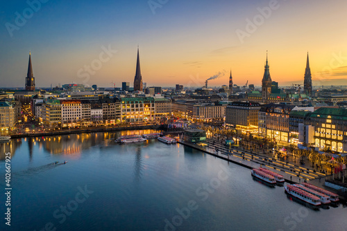 Sunset skyline of Hamburg, Germany along the Binnenalster lake photo