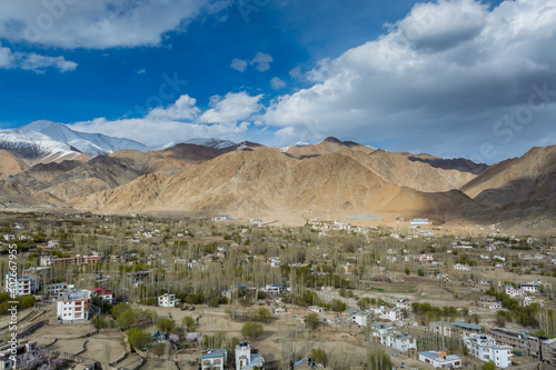 Aerial view of Leh Ladahk City of Kashmir with background of Himalaya mountain against blue sky, view from the Shanti Stupa