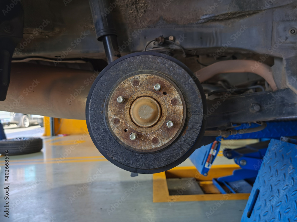 Old disc brakes on cars being repaired. Old disc brakes on cars being repaired.