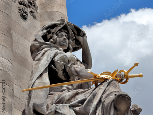 The Renaissance France statue (La France de la Renaissance) by Jules Coutan on the Alexander III bridge (Pont Alexandre III) in Paris, France photo