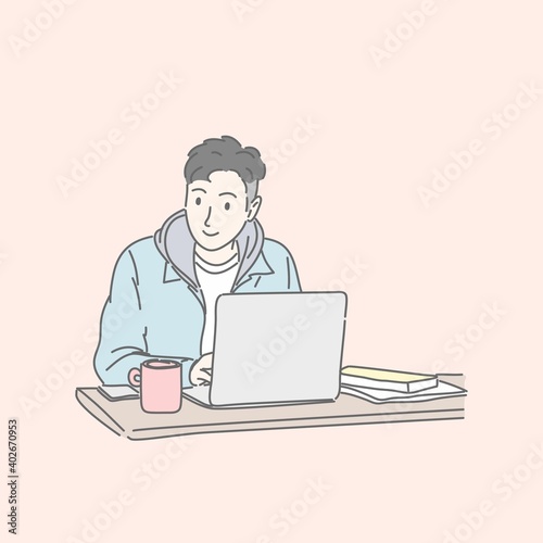 Man sitting and using laptop computer