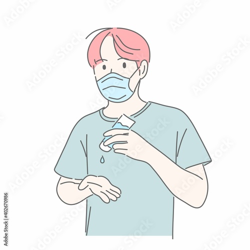 Man wearing medical mask and using alcohol gel to washing hand.