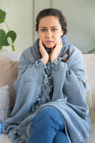 Young woman suffering from cold.