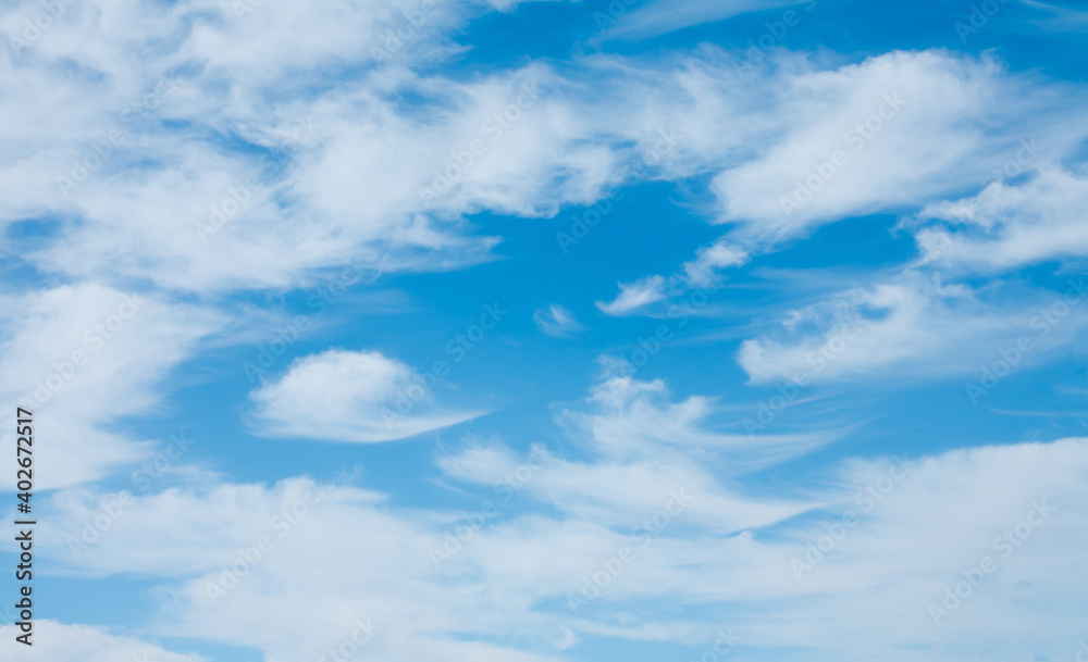 Blue sky with soft white clouds in windy weather