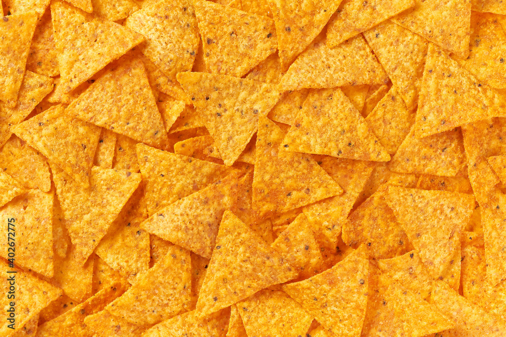 Background of corn tortilla chips or nachos, close up.