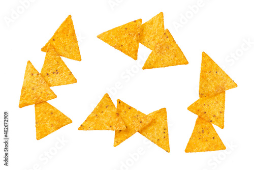 Collection of various corn tortilla chips or nachos isolated on a white background.