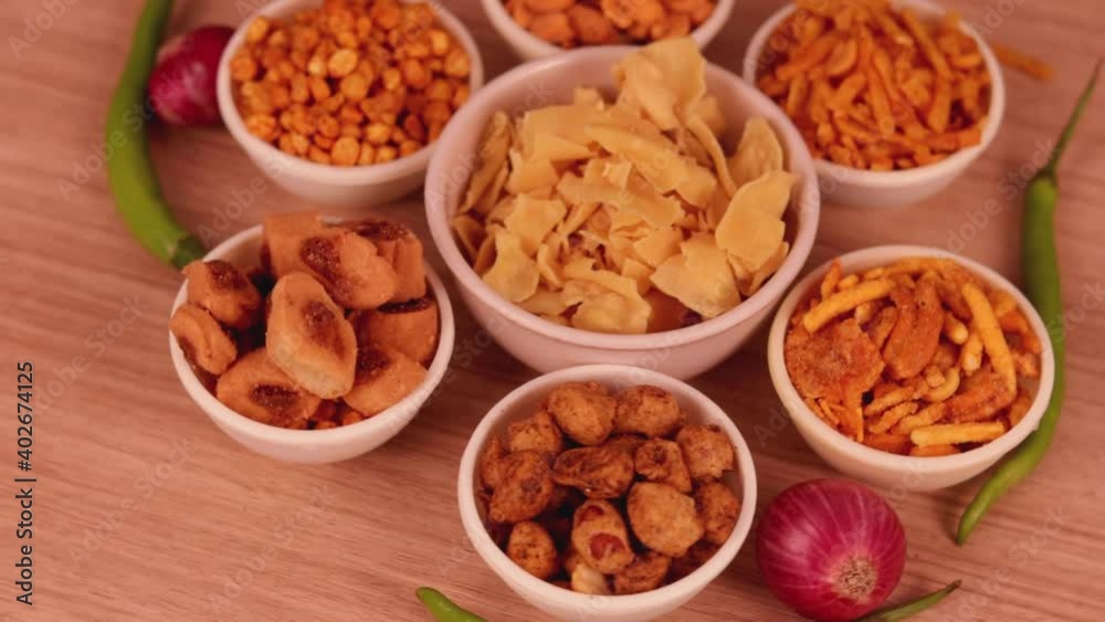 papdi namkeen in middle and other namkeen of the rounding,Namkeen rotating in a circular shape in middle papdi,Namkeen , indian sneak,Namkeen in a bowl papdi namkeen in middle and other namkeen of the rounding,Namkeen rotating in a circular shape in middle papdi,Namkeen , indian sneak,Namkeen in a bowl