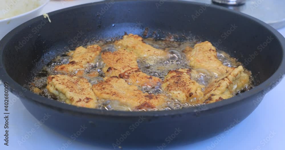 Prawns are fried in a frying pan in the kitchen