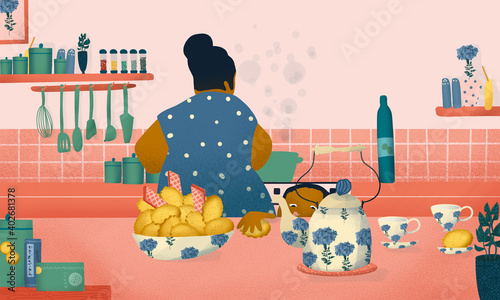 Woman cooking at the kitchen while child stealing a biscuit photo