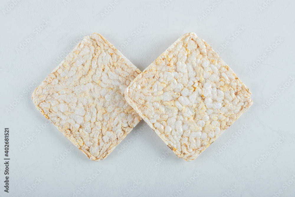 Two delicious airy crispbread on white background Two delicious airy crispbread on white background