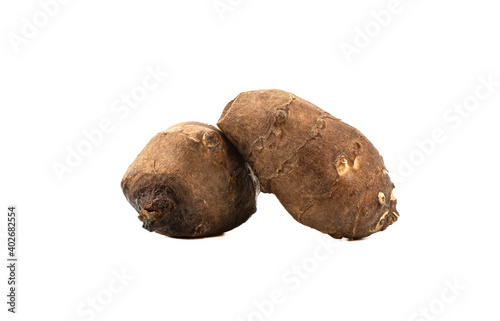 Two Jerusalem artichoke roots isolated on white background. Jerusalem artichoke, or Tuberous sunflower is a type of perennial herbaceous tuberous plants of the genus Sunflower of the Astrovye family. photo