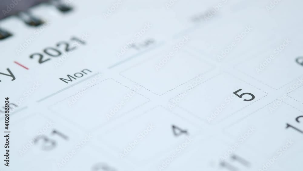 white color 2021 calendar on wooden background 