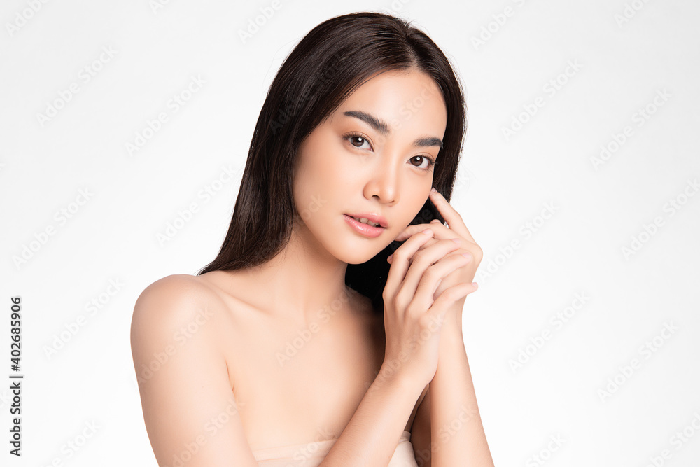 Beautiful Young asian Woman with Clean Fresh Skin, on Pink background, Face care, Facial treatment. Cosmetology, beauty and spa. Asian women portrait Beautiful Young asian Woman with Clean Fresh Skin, on Pink background, Face care, Facial treatment. Cosmetology, beauty and spa. Asian women portrait