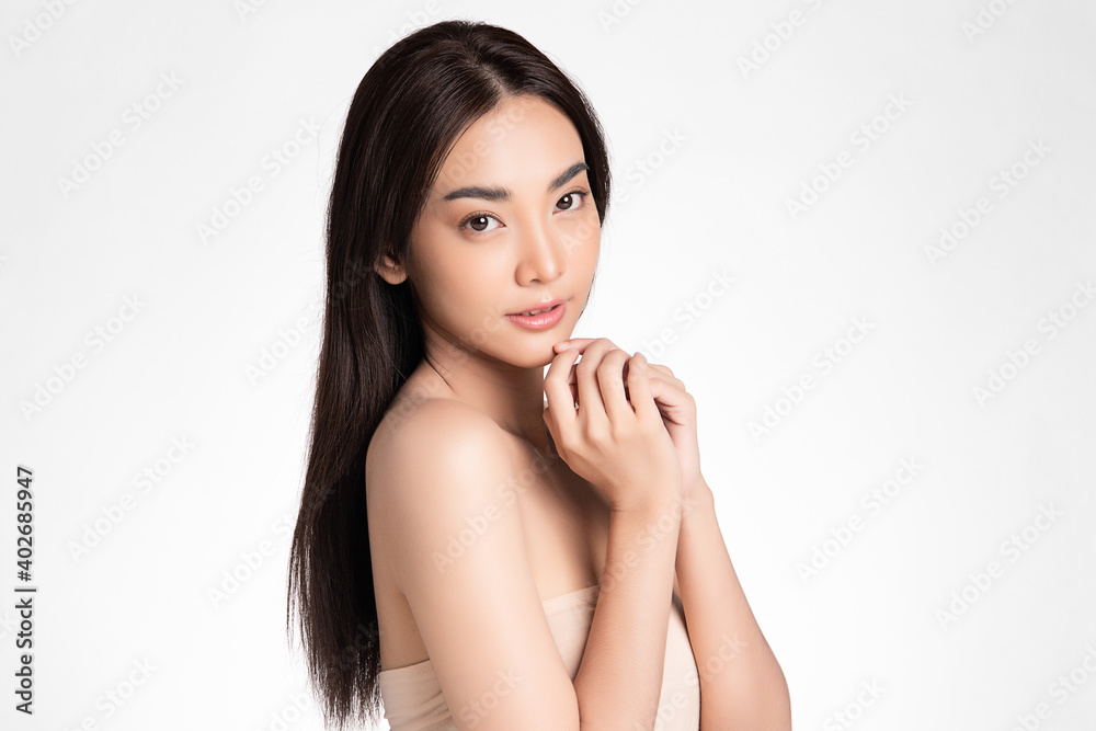 Beautiful Young asian Woman with Clean Fresh Skin, on Pink background, Face care, Facial treatment. Cosmetology, beauty and spa. Asian women portrait Beautiful Young asian Woman with Clean Fresh Skin, on Pink background, Face care, Facial treatment. Cosmetology, beauty and spa. Asian women portrait