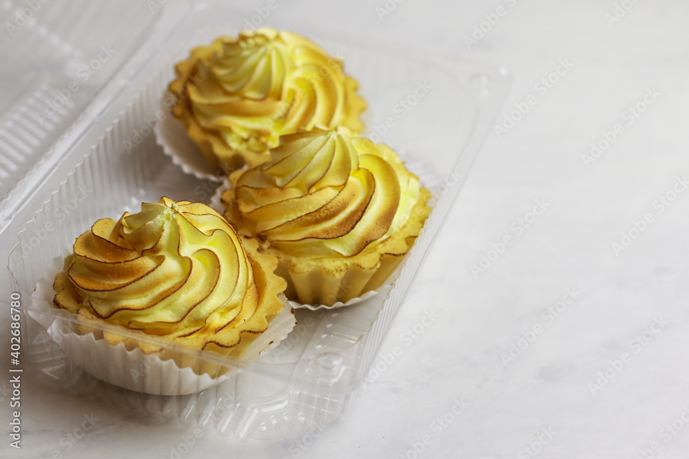 Tasty lemon tart with meringue on light background Tasty lemon tart with meringue on light background