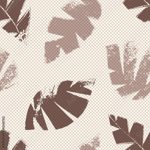 Mono print style scattered leaves seamless vector pattern background. Textured cut out foliage in shades of brown on pastel backdrop. Hand crafted painterly grunge all over print for wellbeing
