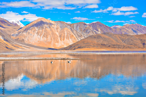 Beautiful view of Pangong Tso Lake and mountain with the background of blue sky