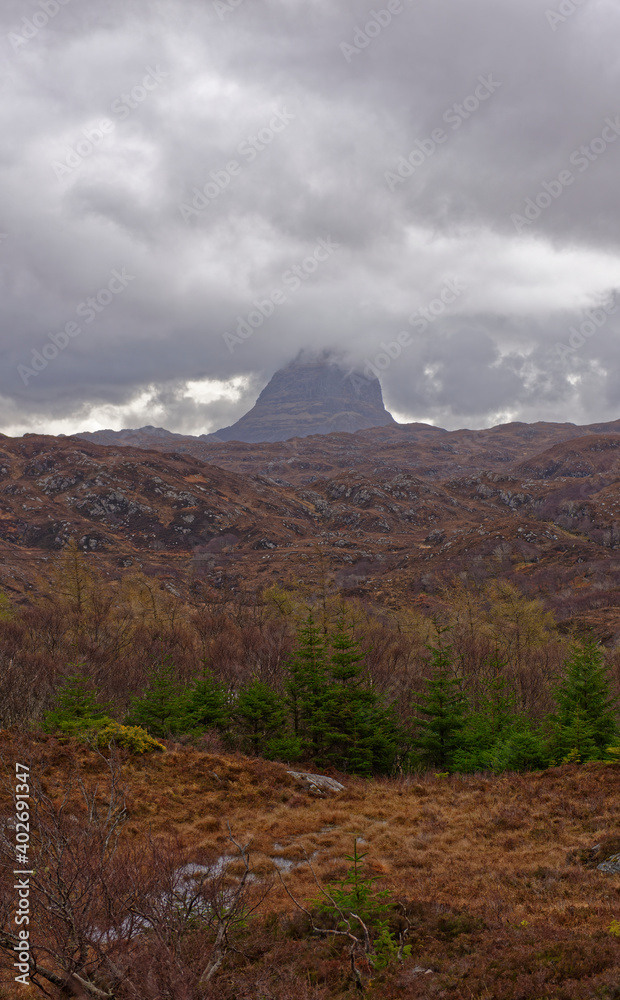 Suilven Mountain near to Lochinver, with low dark clouds covering the summit of Meall Meadhonach as April Storms approach.