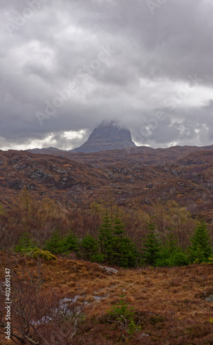 Suilven Mountain near to Lochinver, with low dark clouds covering the summit of Meall Meadhonach as April Storms approach.