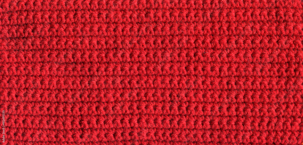 texture of crocheted red canvas with a simple pattern