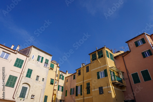 The colourful ancient facades of houses in Imperia old town, Liguria region, Italy