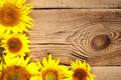 sunflowers on an old wooden background with copy space
