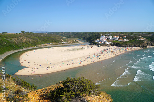 aerial view of Praia de Odeceixe (Odeceixe beach) with river in summer