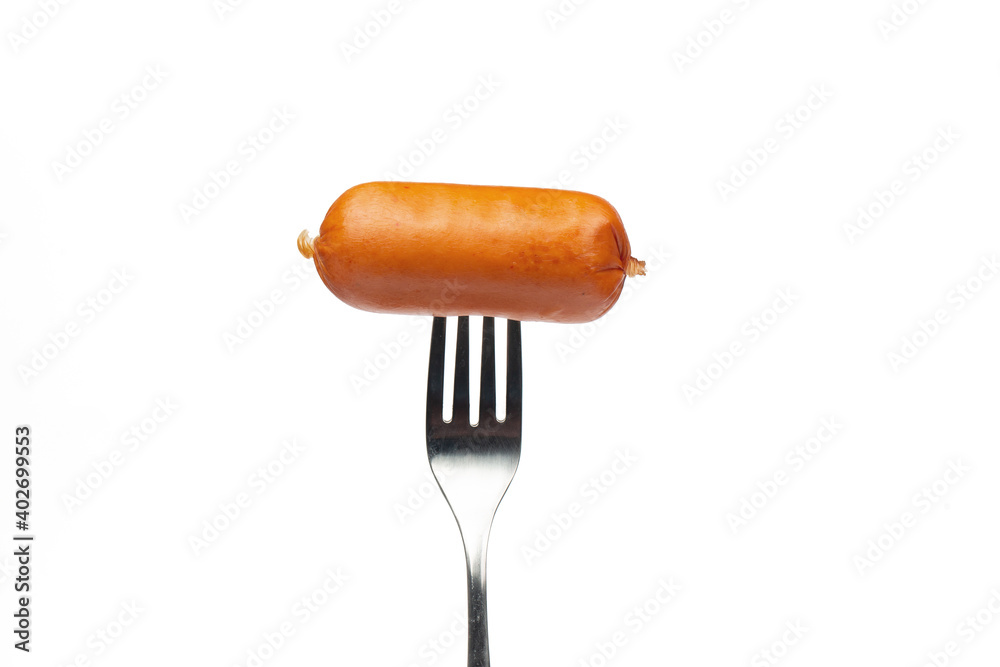 Sausage on fork on white background