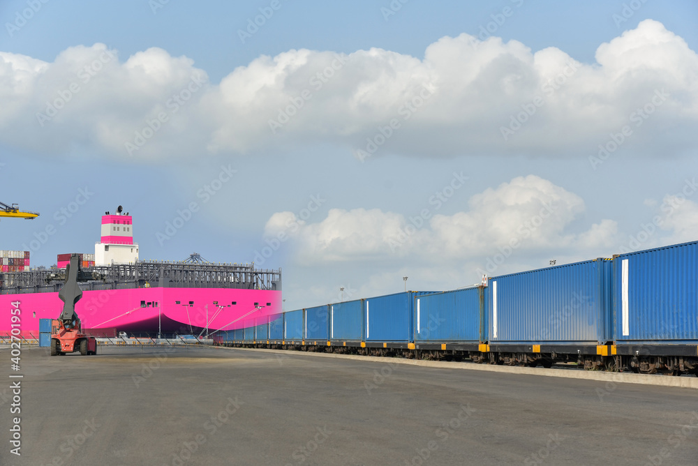 Cargo train platform with freight train Containers on the train on crane loading in port background. Cargo train platform with freight train Containers on the train on crane loading in port background.
