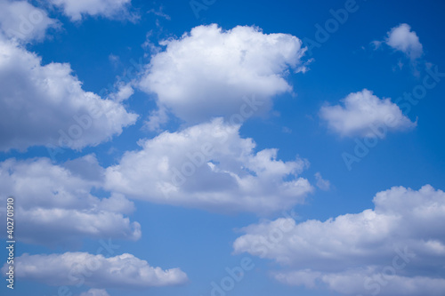 Blue sky with clouds floating in the sky during the day.