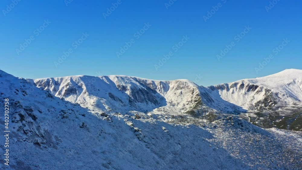 Wonderful landscapes of the Carpathian Mountains covered with snow and clear blue sky in Ukraine near the village of Dzembronya. Aerial UHD 4K drone realtime video, shot in 10bit HLG and colorized Wonderful landscapes of the Carpathian Mountains covered with snow and clear blue sky in Ukraine near the village of Dzembronya. Aerial UHD 4K drone realtime video, shot in 10bit HLG and colorized
