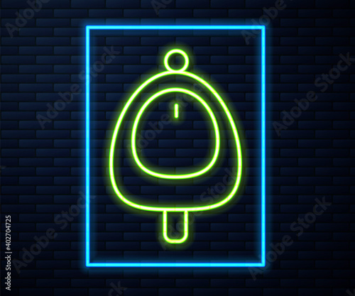 Glowing neon line Toilet urinal or pissoir icon isolated on brick wall background. Urinal in male toilet. Washroom, lavatory, WC. Vector.