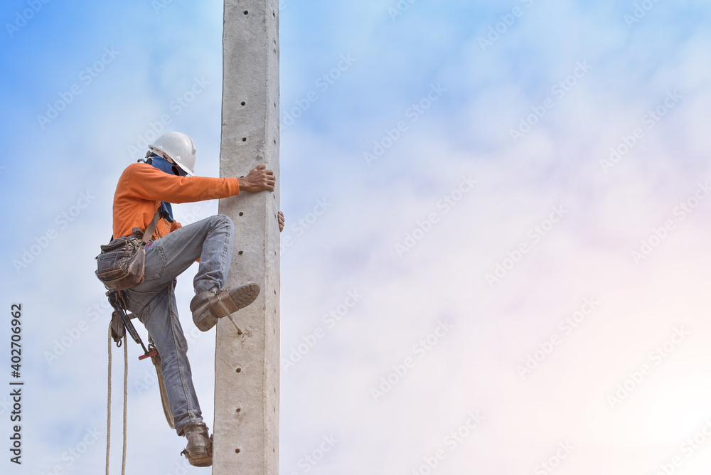 Worker on the high wear safety belt, Electric lineman repairman