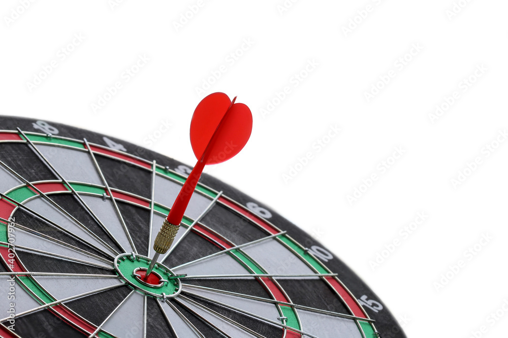Red Dart arrow hitting in the target center of dartboard isolated on white background Red Dart arrow hitting in the target center of dartboard isolated on white background